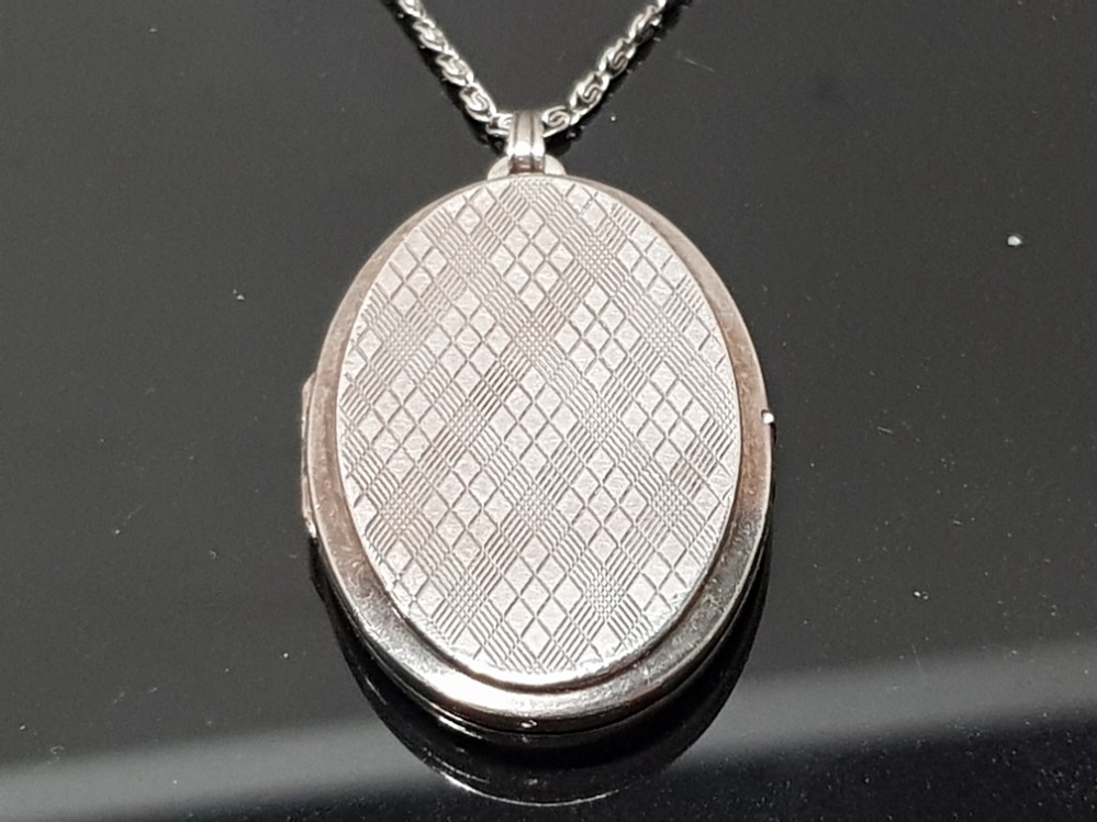 LARGE ENGINE TURNED LOCKET AND CHAIN WITH TARTAN DESIGN TO ONE SIDE