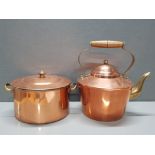 A BRASS AND COPPER KETTLE TOGETHER WITH A BRASS AND COPPER PAN