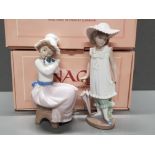 2 NAO BY LLADRO FIGURES 1049 A BIG HUG AND 1126 APRIL SHOWERS BOTH WITH ORIGINAL BOXES
