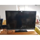 A 40 INCH SONY TELEVISION WITH REMOTE