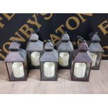 A SET OF 6 BATTERY POWERED CANDLE LANTERNS