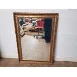 A VERY NICE GILT FRAMED BEVEL EDGED MIRROR 76CM BY 107CM