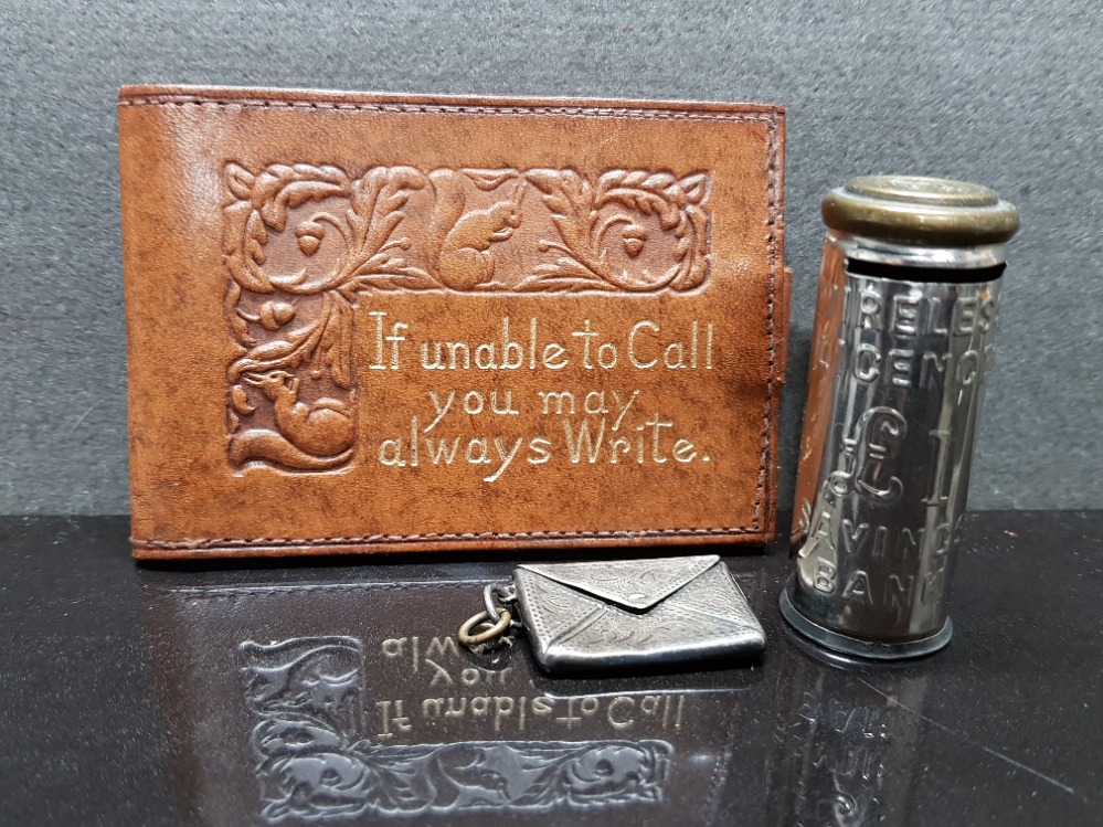 STERLING SILVER STAMPED STAMP ENVELOPE TOGETHER WITH LEATHER STAMP HOLDER AND 1POUND SAVINGS BANK