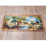 A FRAMED TAPESTRY OF A VILLAGE SCENE WITH PEOPLE FISHING BASED AROUND THE 1800S