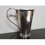 STYLISH WHITE METAL TURNED TANKARD WITH APPLIED FLOURISHING HANDLE AND STEPPED FOOT, MARKED