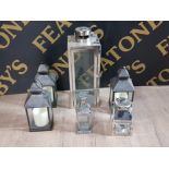 A LARGE CHROME CANDLE LANTERN TOGETHER WITH 3 BATTERY POWERED CANDLE LANTERNS AND 2 OTHERS