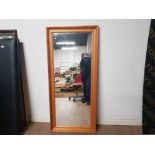 A VERY LARGE PINE FRAMED MIRROR 74CM BY 166CM