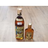A 1 LITRE BOTTLE OF ARTEMI HONEY RUM TOGETHER WITH A 20CL BOTTLE OF METAXA BRANDY