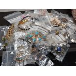 DISH CONTAINING A LARGE QUANTITY OF COSTUME JEWELLERY, BROOCHES, BRACELETS AND EARRINGS ETC