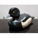 CARVED WOOD TUFTED DUCK DECOY WITH INFO ON THE BOTTOM