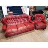 LEATHER BUTTONED BACK 3 SEATER SETTEE AND MATCHING ROCKING CHAIR IN OX BLOOD IN THE STYLE OF AND