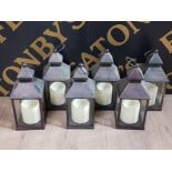 A SET OF 6 BATTERY POWERED CANDLE LANTERNS