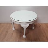 PAINTED MAHOGANY CIRCULAR AND GLASS TOPPED LAMP TABLE WITH CLAW AND BALL FEET