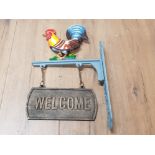 A CAST METAL WALL HANGING COCKEREL WELCOME SIGN
