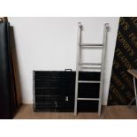 A SET OF ALUMINIUM 4 STEP HOOK ON LADDERS TOGETHER WITH A LARGE BLACK CONFIDENCE DOG CAGE