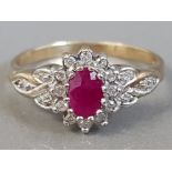 9CT YELLOW GOLD RUBY AND DIAMOND CLUSTER RING APPROXIMATELY. 15CT 2.8G SIZE R