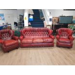 OXBLOOD RED 3 PIECE SUITE INCLUDES 2 WING BACK ROCKERS AND 3 SEATER SOFA IN THE CHESTERFIELD STYLE