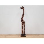 A VERY LARGE WOODEN ORNAMENTAL FIGURE OF A GIRAFFE 100CM TALL