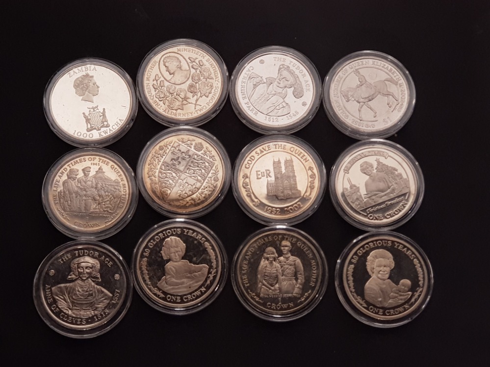 COLLECTION OF 12 DIFFERENT COMMEMORATIVE CROWN SIZE COINS FROM THE COMMONWEALTH HOUSED IN