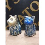 A PAIR OF NAIVE OLD POTTERY CATS WITH HAND PAINTED DECORATION