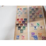 ALBUM OF MISCELLANEOUS STAMPS FROM AROUND THE WORLD INCLUDING ROMANIA, HUNGARY AND YUGOSLAVIA ETC