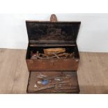 A RUSTED TIN METAL TOOLBOX WITH CONTENTS SUCH AS DRILL BITS ETC