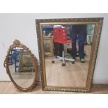 ORNATELY FRAMED OVAL SHAPED MIRROR WITH GILT FRAMED