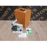 BOXED BIOLOGICAL MICROSCOPE