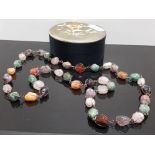 ROUND BOX CONTAINING WHITE METAL CAGE SET SEMI-PRECIOUS BEAD NECKLACE