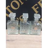 A SET OF 3 GLASS DECANTERS 2 WITH METAL LABELS INC WHISKEY AND SHERRY