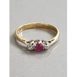 18CT GOLD DIAMOND AND RUBY THREE STONE RING 2.2G SIZE M1/2