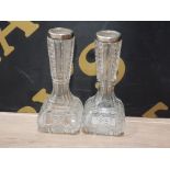 A PAIR OF CRYSTAL VASES WITH SILVER RIMS BIRMINGHAM HALLMARKED 1910