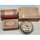 4 WOODEN BOXES, 3 HEAVILY CARVED AND 2 WITH BRASS INLAY