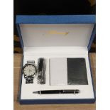 A FANCY 4 PIECE GIFT SET INCLUDES WALLET PEN WATCH ETC