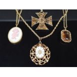 4 VINTAGE YELLOW METAL PENDANT NECKLACES INCLUDES AMBER COLOURED STONE, CROSS AND MOTHERS DAY ROSE