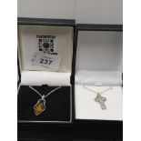 BOXED SILVER ST CUTHBERTS CROSS AND STERLING SILVER CHAIN TOGETHER WITH AN AMBER COLOURED WITH