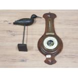 A C1930 OAK CASED BAROMETER WITH PRESENTATION BRASS PLAQUE AND A CARVED WOODEN SCULPTURE OF A BIRD