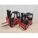 A PAIR OF HOBBY ENGINE REMOTE CONTROLLED FORKLIFTS 1 FULLY WORKING THE OTHER FOR SPARES AND
