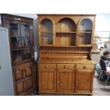 A MODERN PINE WELSH STYLE DRESSER THE TOP WITH TWO GLAZED DOORS 131CM WIDE 189 HIGH 44CM DEEP