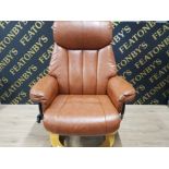 A STRESSLESS STYLE SWIVEL ARM CHAIR AND FOOTSTOOL WITH STORAGE COMPARTMENT