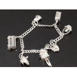 HALLMARKED SILVER CHARM BRACELET WITH 7 CHARMS, TELEPHONE BOX, DOUBLE DECKER BUS, LOVE HEART LOCK