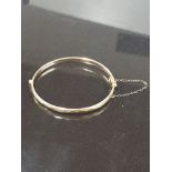 9CT GOLD WITH BRONZE CORE BANGLE BY LAWSON WARD AND GAMMAGE LAGARMIC WITH SAFETY CHAIN 85MM X 50MM X