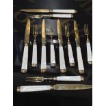 A TWELVE PIECE SET OF GEORGE V SILVER GILT AND MOTHER OF PEARL FRUIT KNIVES AND FORKS BY MAPPIN