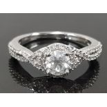 14K WHITE GOLD DIAMOND RING, CONTAINING 60 SMALL DIAMONDS AND 1 LARGE ROUND BRILLIANT CUT CENTRE