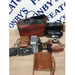 A BAG OF MISCELLANEOUS CAMERAS BINOCULARS AND CAMERA BAGS ETC