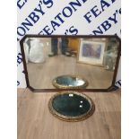 A VINTAGE MAHOGANY FRAMED MIRROR WITH BEVEL EDGE TOGETHER WITH OVAL SHAPED ORNATE BEVEL EDGED