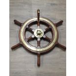 A VINTAGE 6 SPINDLE SHIP WHEEL WITH BRASS INLAID PART OF A FLEET IN DUNKIRK, THE WILLDORA SHIP