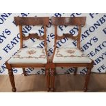 A PAIR OF REGENCY STYLE MAHOGANY DINING CHAIRS WITH DROP IN TAPESTRY SEATS RAISED ON TURNED REEDED