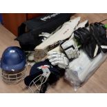 LARGE AMOUNT OF CRICKETING GEAR TO INCLUDE 4 PAIRS OF PADS, 2 HELMETS WITH GUARDS, BAT ETC