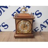 A REPRODUCTION GILT MANTLE CLOCK